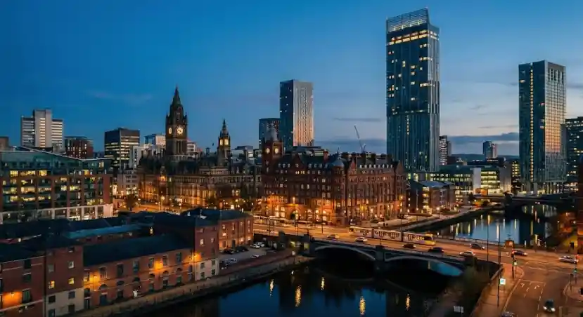 Lux Cars executive chauffeur vehicle on a night city tour through a landmark UK location